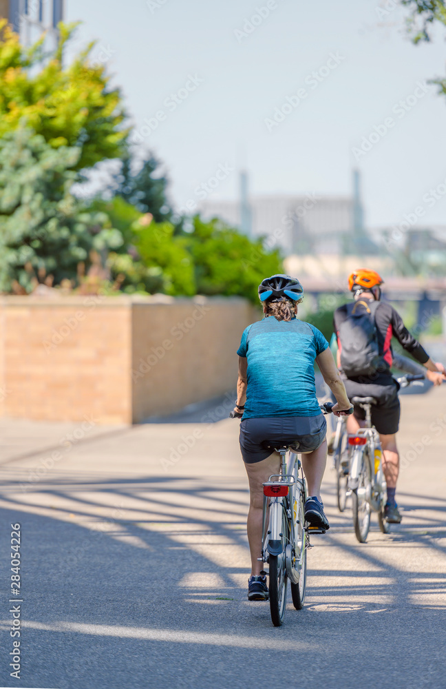 Man and woman take bicycles to strengthen their physical condition Man and woman take bicycles to strengthen their physical condition