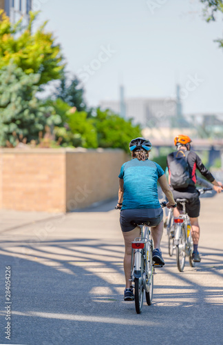 Fototapeta Naklejka Na Ścianę i Meble -  Man and woman take bicycles to strengthen their physical condition