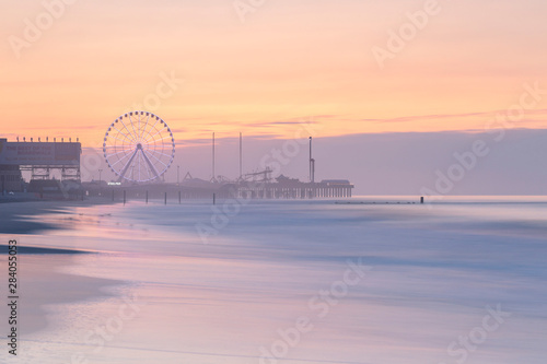Luna park on the pier  in Atlantic City at sunrise with long exposure photo