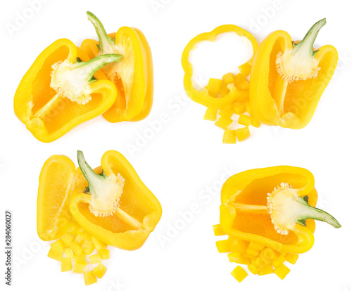 Set of ripe yellow bell peppers on white background, top view
