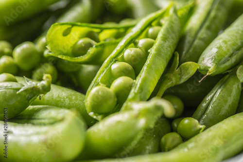Fresh green pea seeds and pods - Close up
