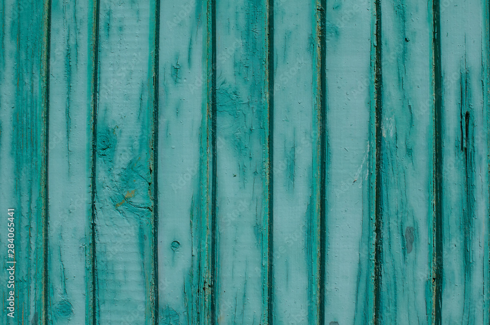 Old weathered grunge green painted wooden boards wall closeup as background Old weathered grunge green painted wooden boards wall closeup as background