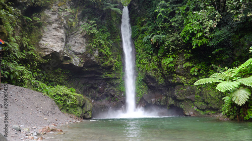 Waterfall in green rainforest. Tropical Tuasan Falls in mountain jungle. waterfall in the tropical forest. Camiguin, Philippines, Mindanao
