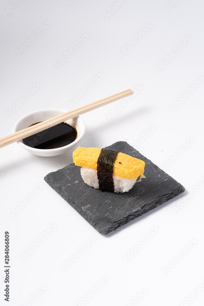 Mix sushi set, Japanese food on slate platte isolated white background Mix sushi set, Japanese food on slate platte isolated white background