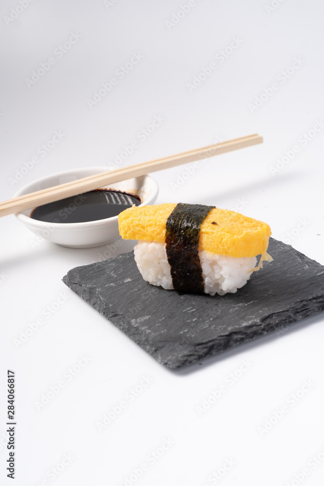 Mix sushi set, Japanese food on slate platte isolated white background Mix sushi set, Japanese food on slate platte isolated white background