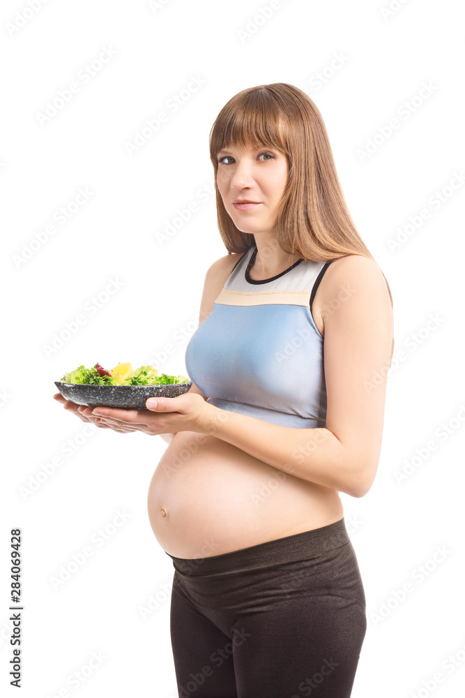 Beautiful pregnant woman with healthy salad on white background Beautiful pregnant woman with healthy salad on white background