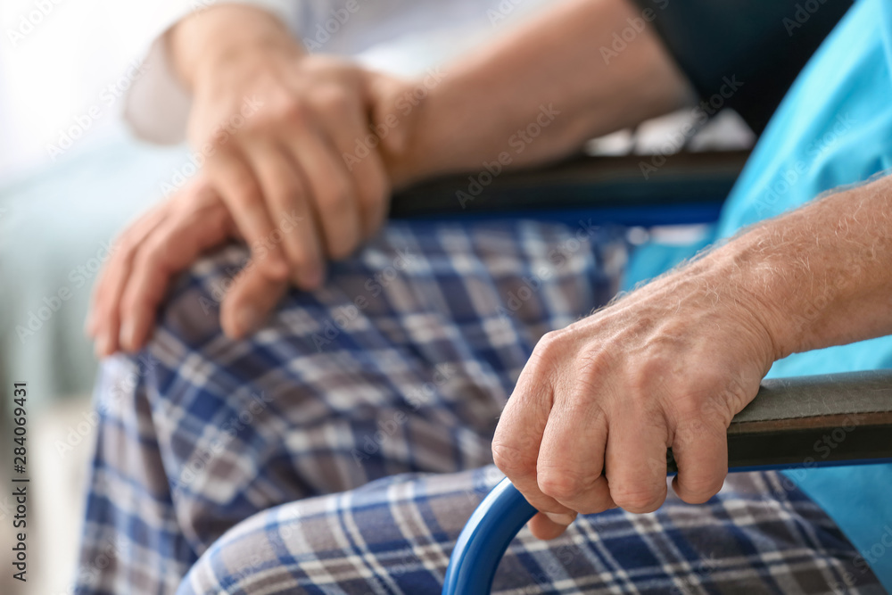 Doctor with elderly man in nursing home, closeup Doctor with elderly man in nursing home, closeup