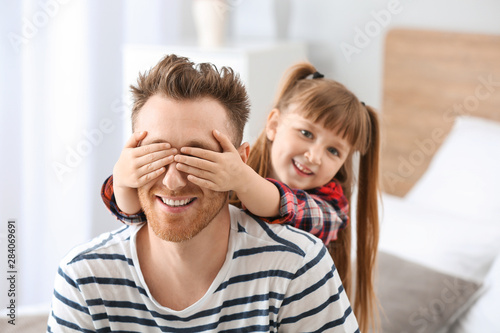 Portrait of happy father an...