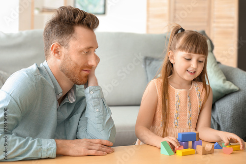 Portrait of happy father an...