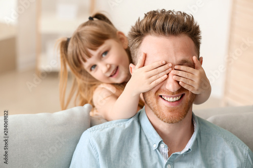 Portrait of happy father an...