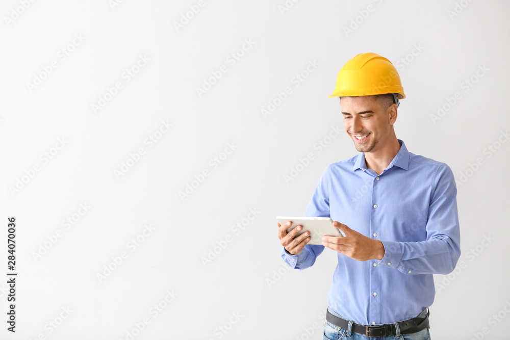 Handsome male architect with tablet computer on white background Handsome male architect with tablet computer on white background