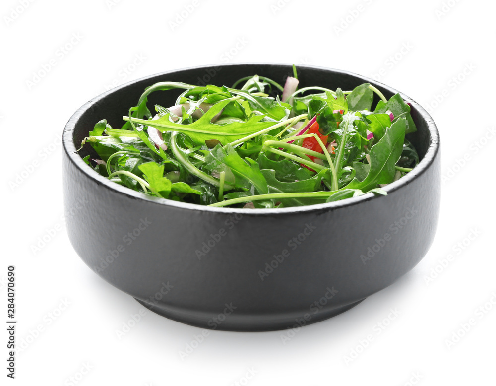 Bowl with tasty arugula salad on white background Bowl with tasty arugula salad on white background