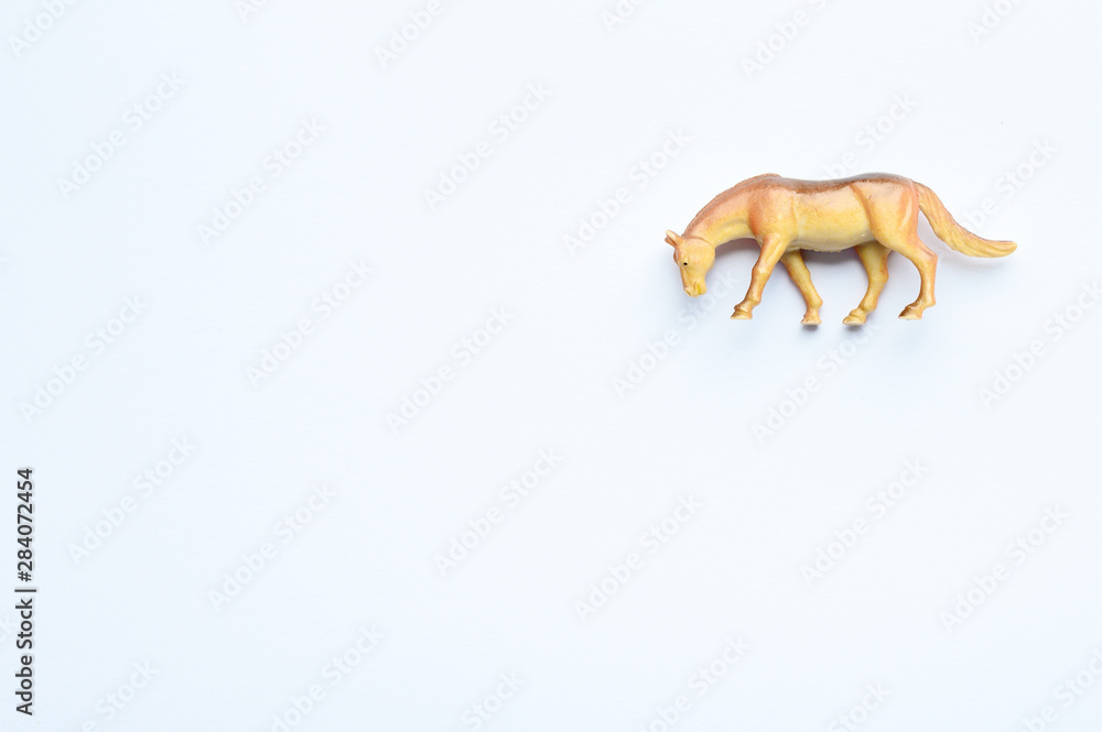 Figurine of a horse on white background