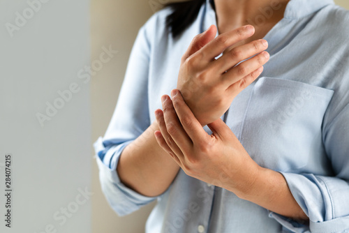 woman wrist arm pain long working. office syndrome healthcare and medicine concept photo
