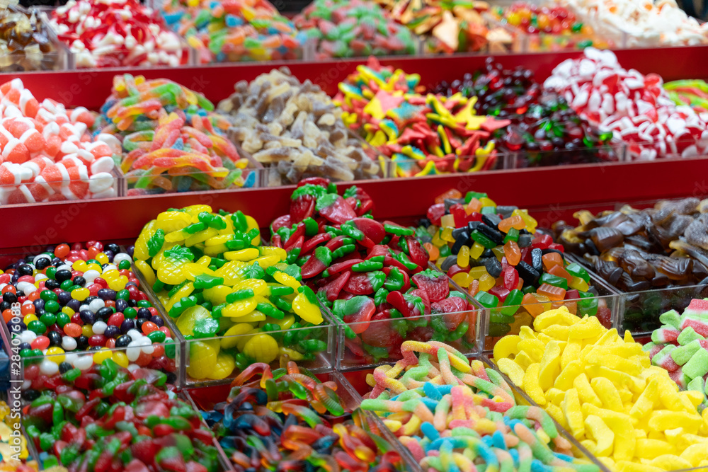 closeup of a table of different types of candy for sale