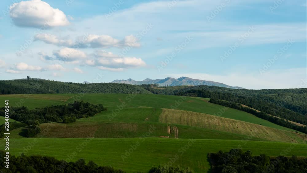 Timelapse of Tatra Mountains With Meadows and Groves, From Daylight to Twilight Timelapse of Tatra Mountains With Meadows and Groves, From Daylight to Twilight