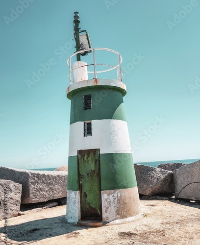 lighthouse on coast of sea