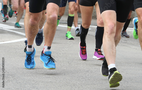 athletes participate in a road marathon