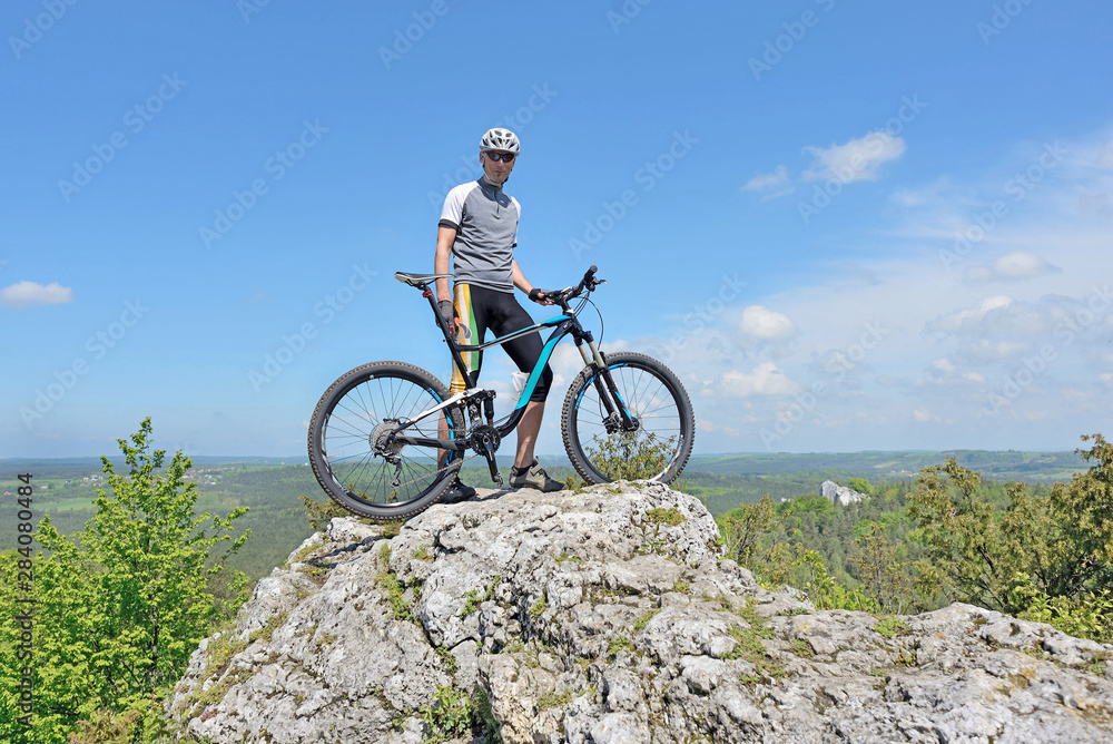 Zborów Mountain, Poland. Man on top of a mountain on a bike. Zborów Mountain, Poland. Man on top of a mountain on a bike.