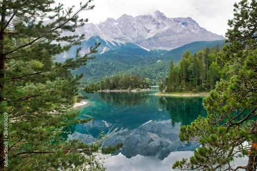 Eibsee lake in front of Zugspitze mountain in Bavaria Germany. Alpine landscape with German Alps mountain Zugspitze 