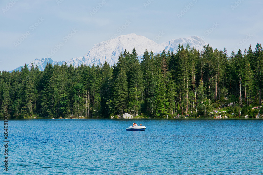 Beautiful sunny summer day on Hintersee lake in Ramsau Berchtesgaden Germany with a view to german and austrian Alps Beautiful sunny summer day on Hintersee lake in Ramsau Berchtesgaden Germany with a view to german and austrian Alps