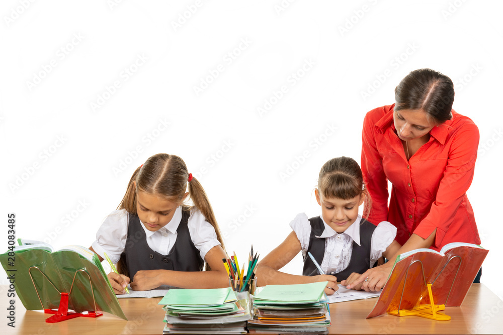 The teacher goes around the students, looks in the notebook, the students solve the task The teacher goes around the students, looks in the notebook, the students solve the task