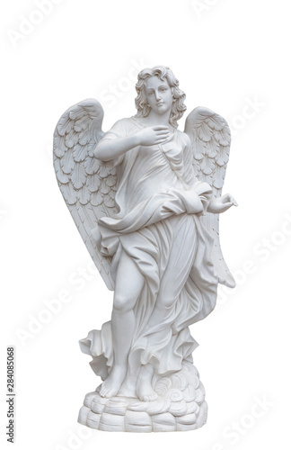 Angel sculpture with wings in European church against white background