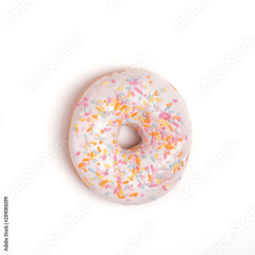 Delicious glazed donut with sprinkles on the white background