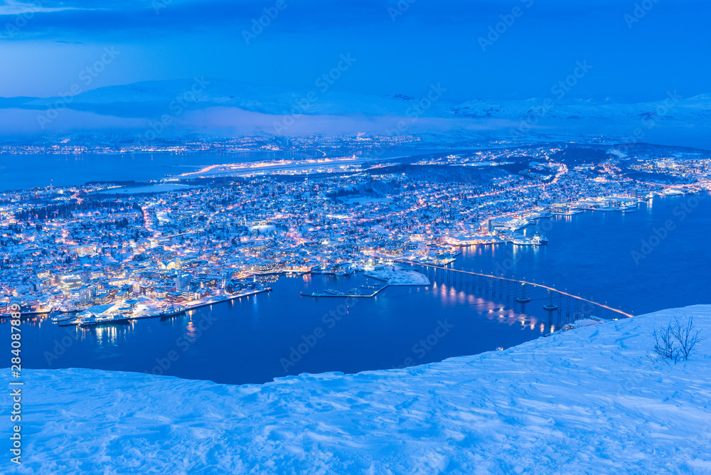Fototapeta premium Sunset over Tromso, Norway during winter