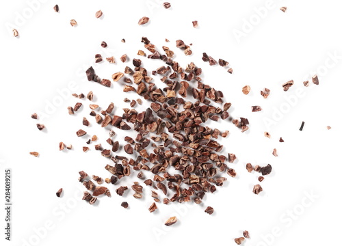 Chopped cocoa pile isolated on white background, top view