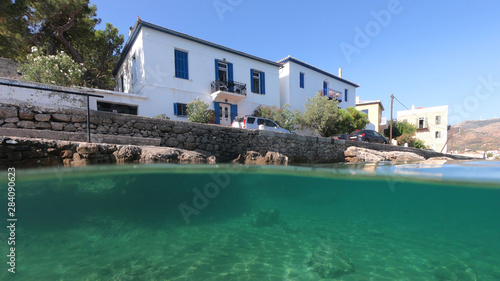 Fototapeta Naklejka Na Ścianę i Meble -  Above and below underwater photo from famous and picturesque village of Galaxidi, Fokida, Greece