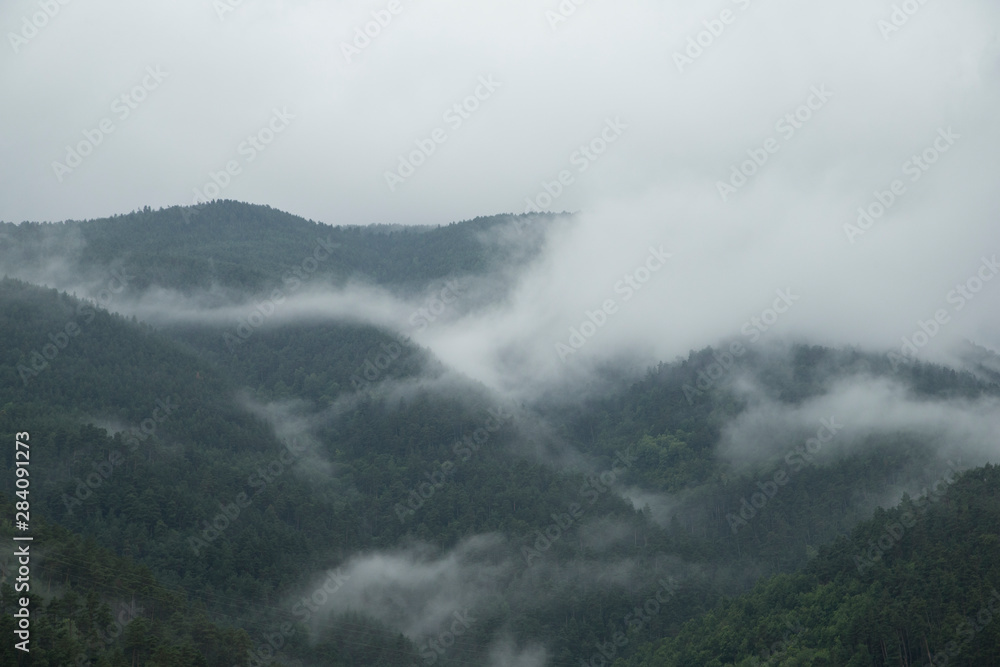 Mountains between mists.