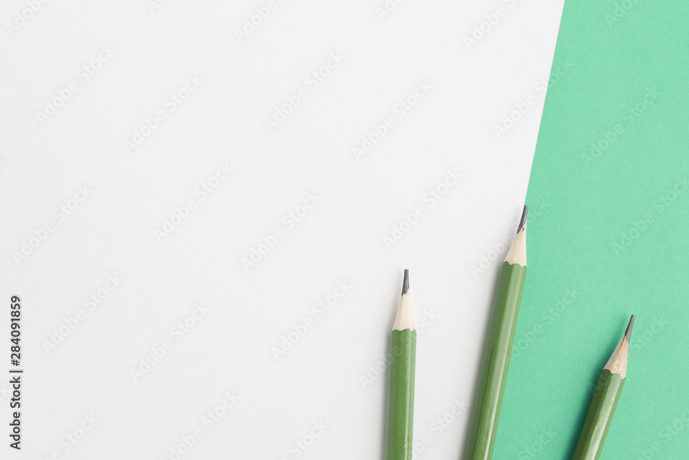 Green sharp pencils on dual background Green sharp pencils on dual background