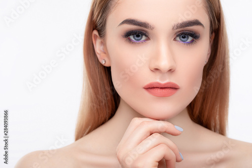 Close up portrait of girl on white background. Hi-end retouch. Beauty concept.