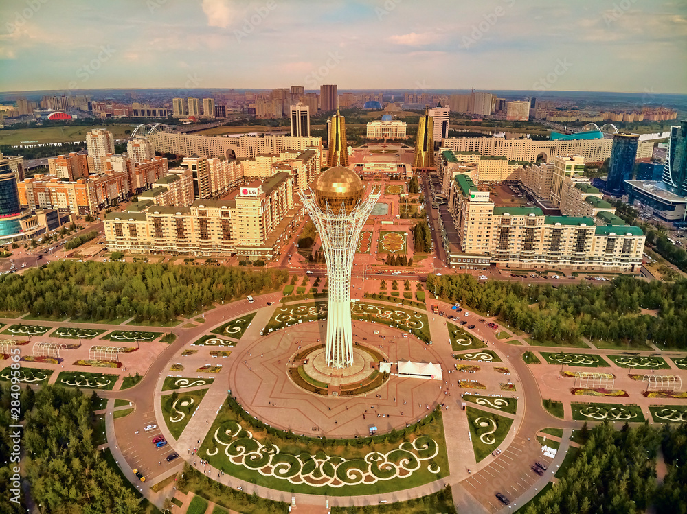 NUR-SULTAN, KAZAKHSTAN (QAZAQSTAN) - July 29, 2019: Beautiful panoramic aerial drone view to Nursultan (Astana) city center with skyscrapers and Baiterek Tower - symbol of Kazakh people freedom