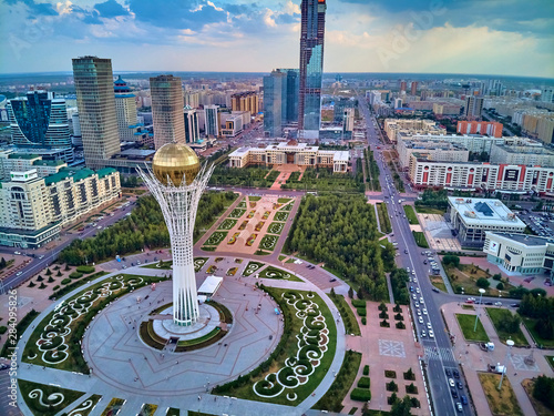 NUR-SULTAN, KAZAKHSTAN (QAZAQSTAN) - July 29, 2019: Beautiful panoramic aerial drone view to Nursultan (Astana) city center with skyscrapers and Baiterek Tower - symbol of Kazakh people freedom photo