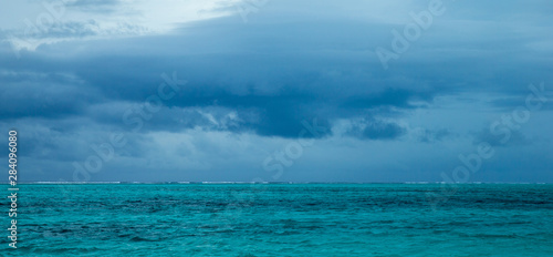 Horizontal view of dramatic overcast sky and sea. © photolink