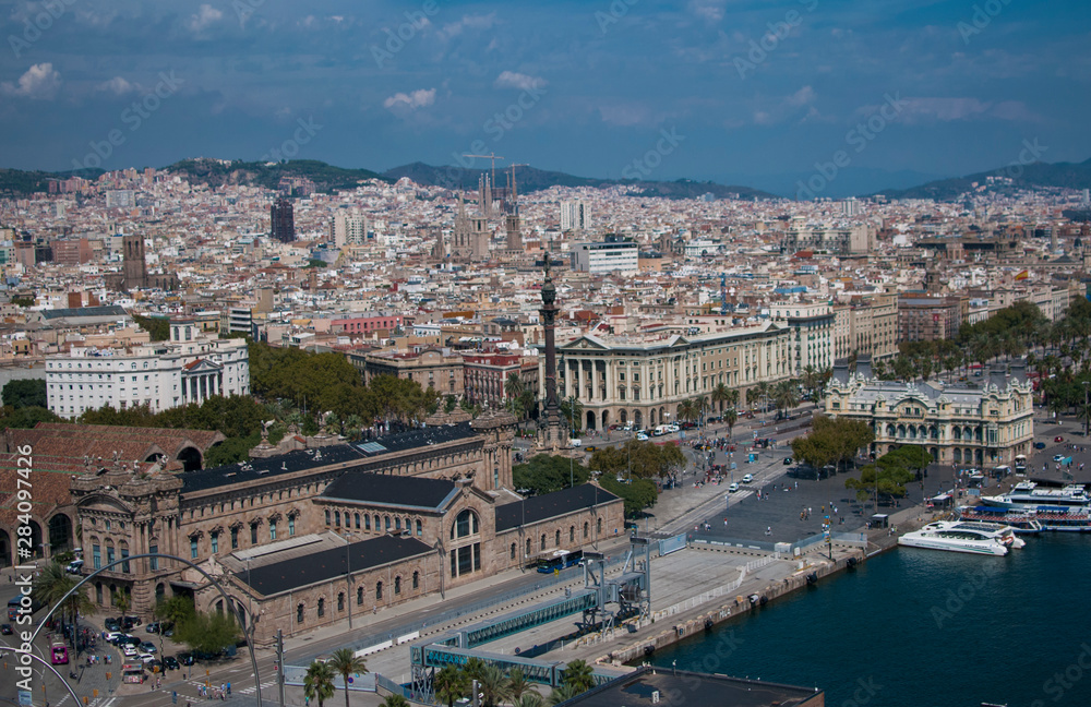 BARCELONA, SPAIN - SEPTEMBER 9, 2014: Aerial view of Barcelona, Maritime Museum, from the cableway to the Montjuic hill with the Barceloneta beach and Port Vell. Catalonia, Spain, Europe