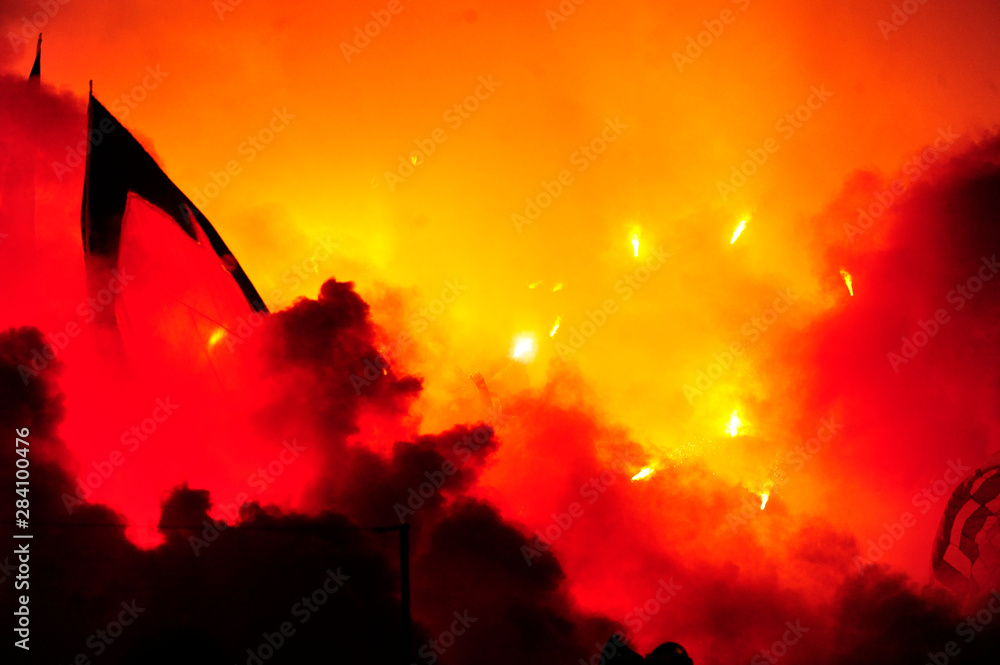 Plakat Fans of serbian soccer team FC Red Star lit torches ofter team scored a goal