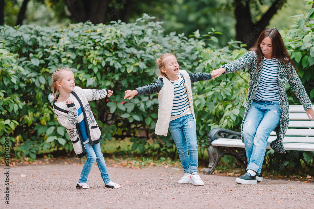 Fototapeta premium Happy family having fun on beautiful autumn day