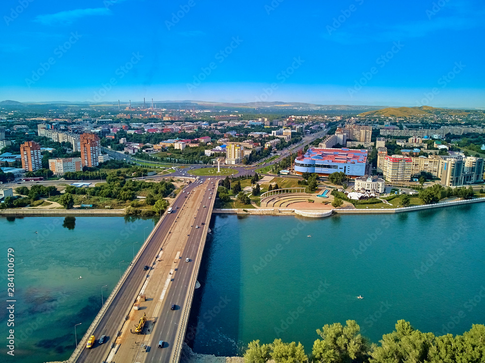 UST-KAMENOGORSK, KAZAKHSTAN (QAZAQSTAN) - August 08, 2019: Beautiful panoramic aerial drone view to Baiterek (Bayterek) Tower - symbol Kazakh's people freedom - in Oskemen
