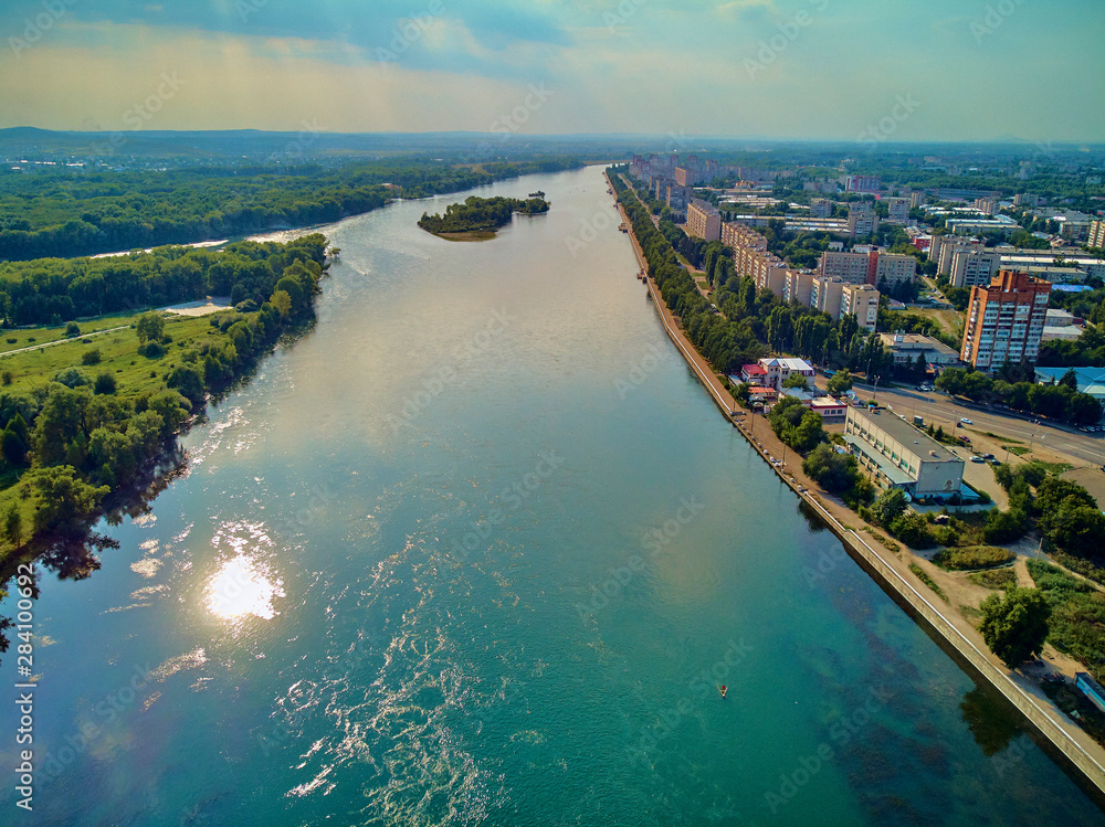 UST-KAMENOGORSK, KAZAKHSTAN (QAZAQSTAN) - August 09, 2019: Beautiful panoramic aerial drone view to the confluence of the rivers Irtysh and Ulba in Oskemen