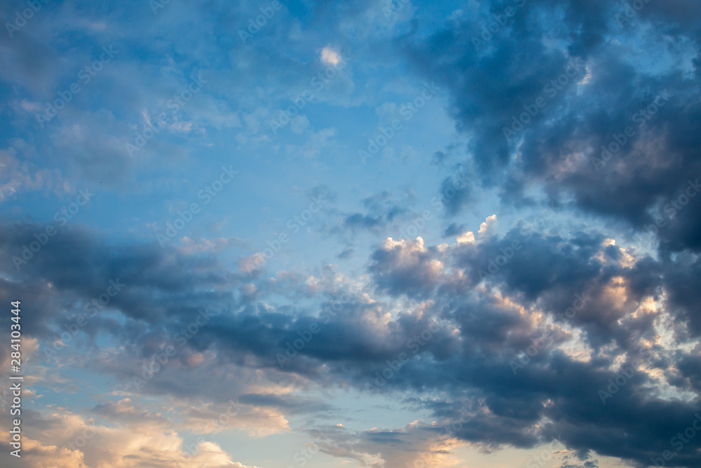 Fototapeta premium Natural background with sky and clouds. Dramatic sky with clouds. Dark sky with Cumulus clouds.