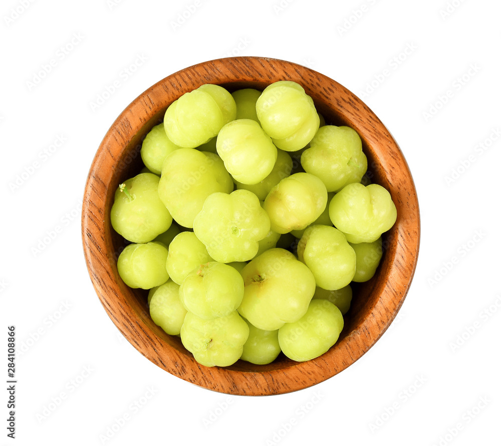star gooseberry in wood bowl on white background star gooseberry in wood bowl on white background