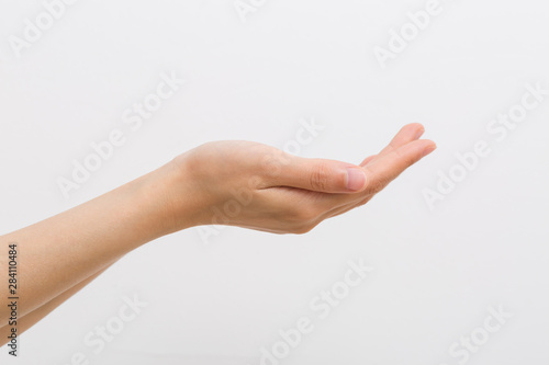 Outstretched cupped hands of young woman