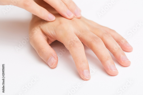 Beautiful woman's hands on white background. Care about hand. Clean skin, Gesturing photo