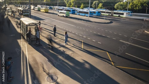 passengers waiting and boarding buses at the bus terminal, time lapse