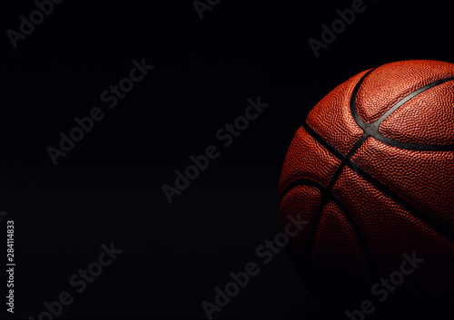 basketball ball on black background. © The Len
