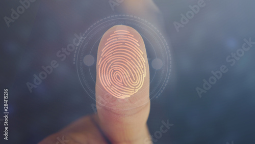 Businessman login with fingerprint scanning technology. fingerprint to identify personal, security system concept photo