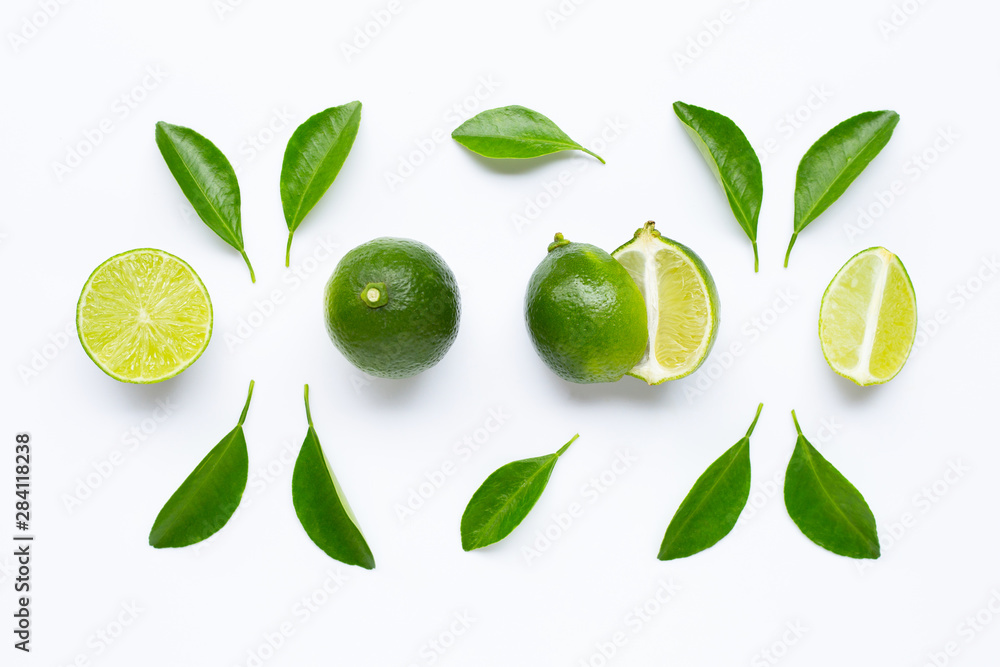 Fresh limes with leaves isolated on white Fresh limes with leaves isolated on white